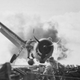 The Iron Works brings home another pilot: a Hellcat piloted by Ens. Byron Johnson crash lands on USS Enterprise, while catapult officer Lieutenant Walter Chewing climbs on the plane’s belly tank to rescue the pilot. (US Navy)